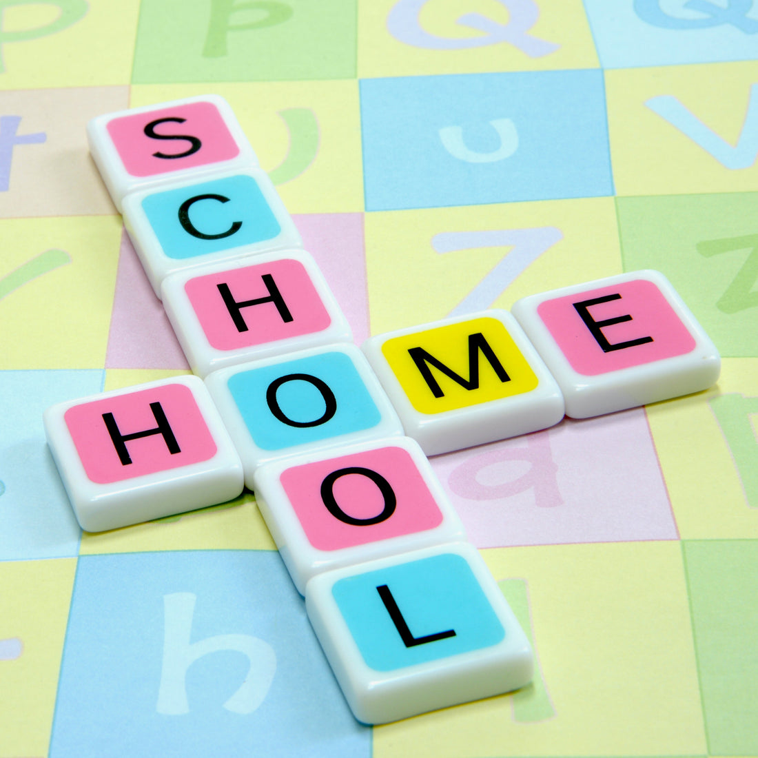 Play is our favorite way to learn. Candygrams can help reinforce learning, spelling, and critical thinking. ‘home school' crossword made with colorful letter tiles over an alphabet background