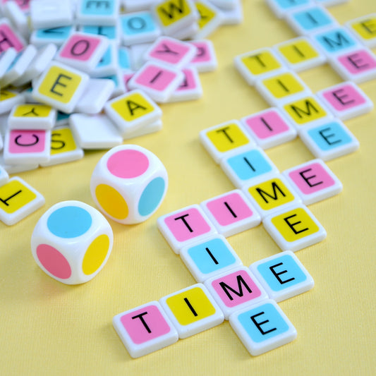 Candygrams takes about 15 minutes to play. ‘time’ crossword made with colorful letter tiles and pastel dice on a yellow background