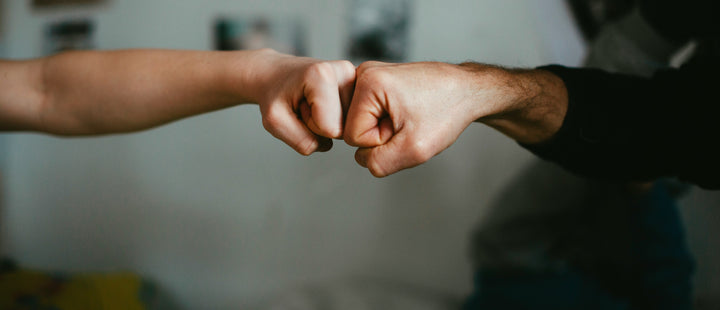 family board game for all ages, young and old play together over two fists bumping