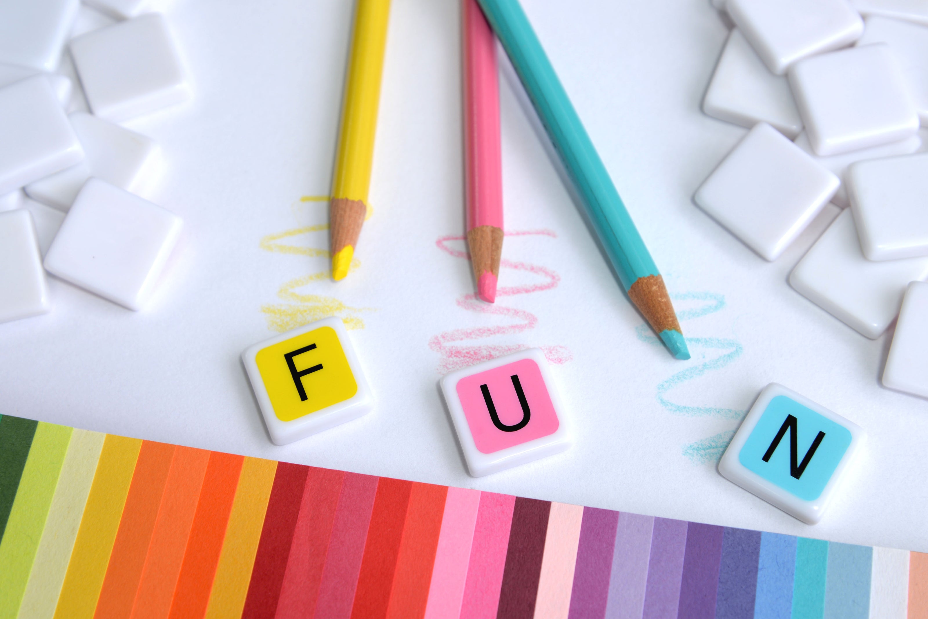 candygrams word game with 'Fun' pastel colored letter tiles and matching colored pencils
