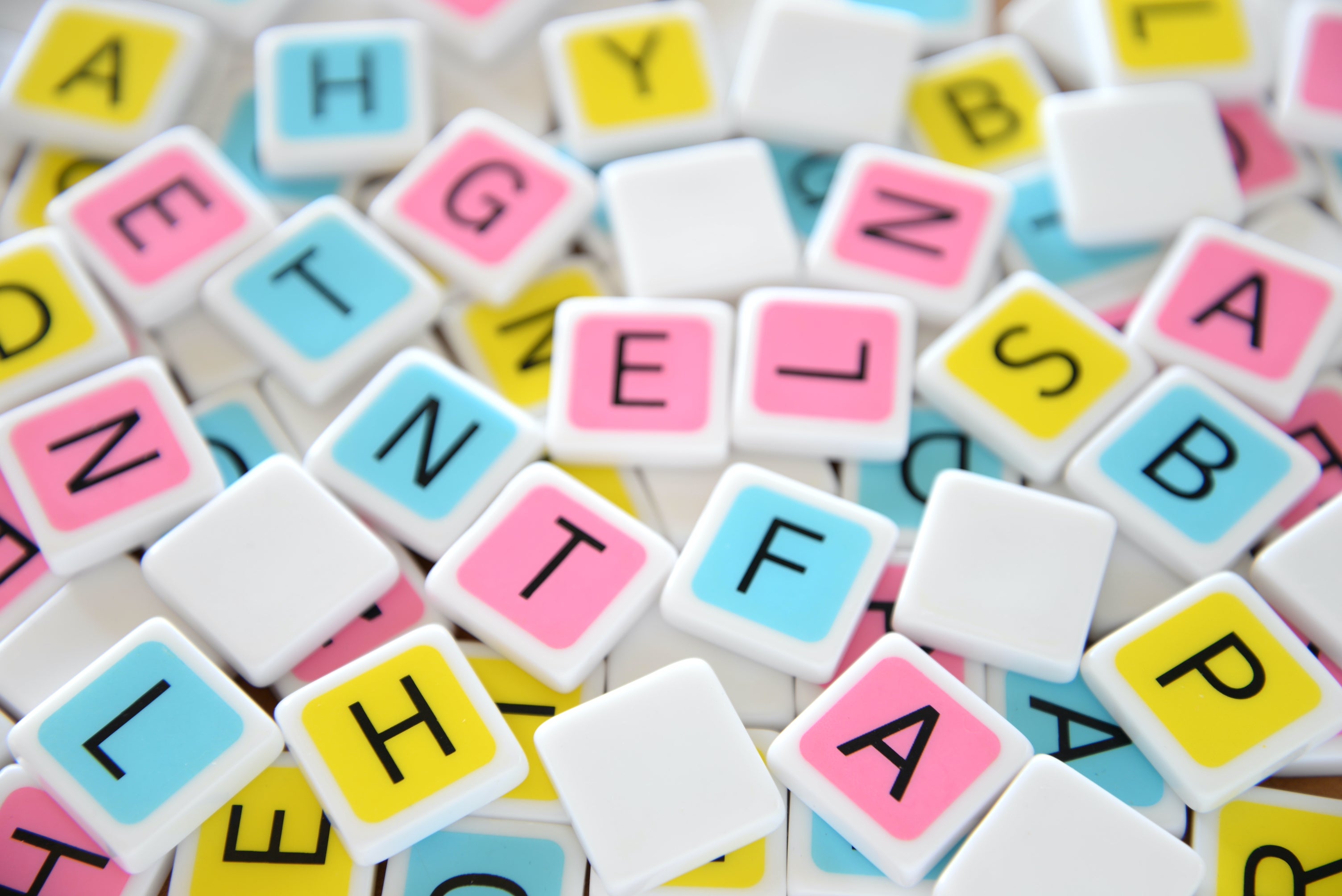 candygrams the next great American board game over a background of a pile of colorful letter tiles